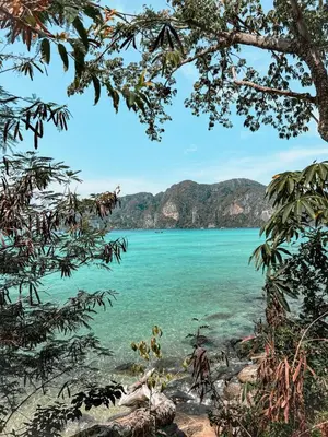a view of a beach with mountains in the background at Hangover Aonang in Ao Nang Beach