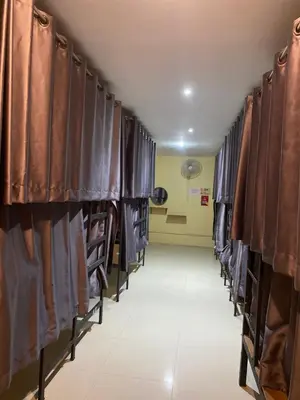 a row of stalls in a hospital hallway with curtains at Hangover Aonang in Ao Nang Beach