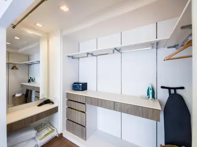 a room with white and gray cabinets and shelves at Townhouse in Laguna Park in Phuket Town