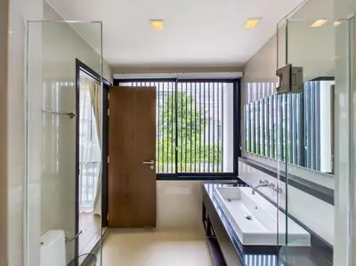 a bathroom with a sink and a window at Townhouse in Laguna Park in Phuket Town