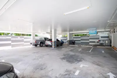 an empty parking lot with cars parked in it at Shyne Place in Phuket Town