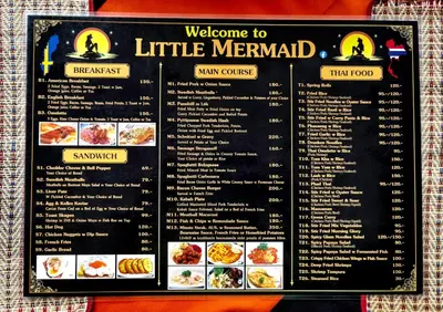 a menu for a little mermaid restaurant at Little Mermaid Guesthouse & Restaurant in Kata Beach