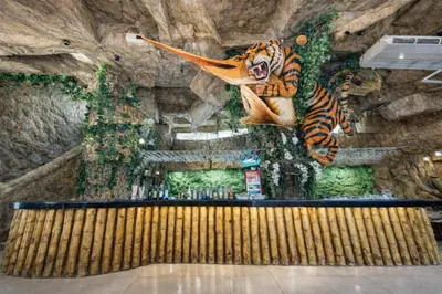 a tiger painting on the wall of a bar at Tiger Complex Hotel in Patong Beach