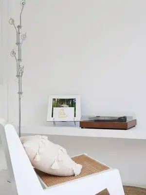 a living room with a white couch and a table at MoonE in Karon Beach