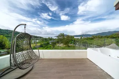 a balcony with a hammock and a bath tub at Scenic Seaview 270 Panorama, 2BR Penthouse VV Patong C701 in Patong Beach