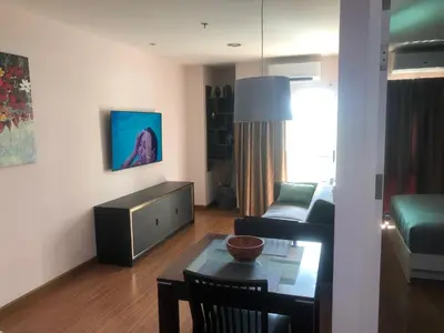 a living room with a couch and a table at Phuket Villa Patong- Pool View in Patong Beach
