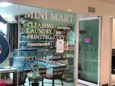 a window of a mini mart with a sign on it at Phuket Villa Patong- Pool View in Patong Beach