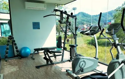 a gym with a bunch of exercise bikes in a room at Zcape1 apartment at Boat Avenue by Lofty in Bang Tao Beach