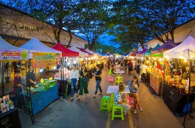a crowd of people walking through a market with tents at Zcape1 apartment at Boat Avenue by Lofty in Bang Tao Beach