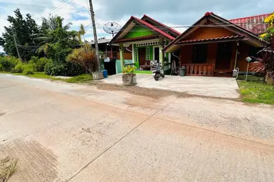 a house on the side of a dirt road at Lamsai AC Sea House in Ko Yao Noi