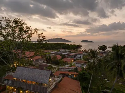 an aerial view of a town with the ocean at Artisan koh yao yai handcraft beachfront villas. in Ban Lo Pa Ret