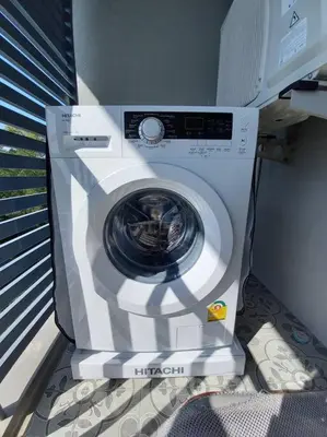 a washing machine is sitting in a room at B6 НОВАЯ на БАССЕЙН ВАТСАП669З582I976 in Nai Yang Beach