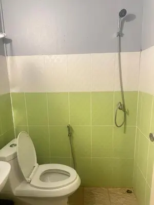 a bathroom with a toilet and a shower at Phi Phi Goodview Bungalow in Phi Phi Don