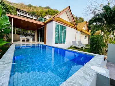 a swimming pool in the backyard of a house at Baan Saint-Tropez Seaview Villas Kata Beach in Kata Beach
