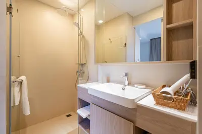 a bathroom with a sink and a mirror at Apartment in laguna , 600 metres from the beach in Phuket Town