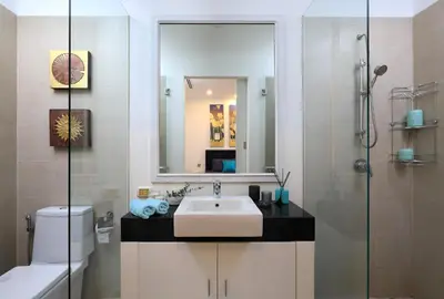 a bathroom with a sink and a mirror at Villa 242 - private pool, fast internet in Ban Thalat Choeng Thale