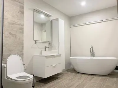 a bathroom with a tub and a toilet and a sink at Stylish Pool Villa - 10 Minutes walk to the Beach in Kamala Beach