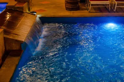 a large swimming pool with a blue water at Diva Patong Hotel in Patong Beach