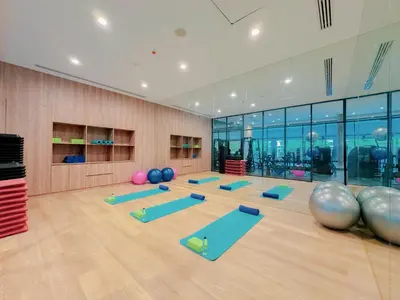 a yoga room with a lot of yoga mats at Laya Resort Phuket in Layan Beach