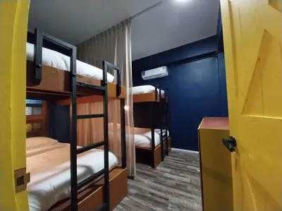 a bunk bed room with three bunk beds in it at W168 hostel in Ban Lo Long