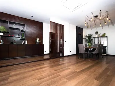 a living room with a table and a dining room at Grand Penthouse by Grand Orlov Apart in Patong Beach
