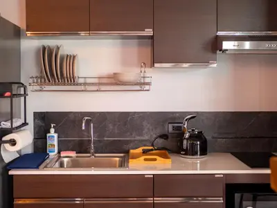 a kitchen with a sink and a counter top at Grand Penthouse by Grand Orlov Apart in Patong Beach