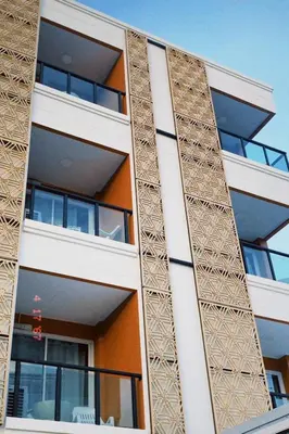 an exterior view of an apartment building at Sasimanta in Kamala Beach