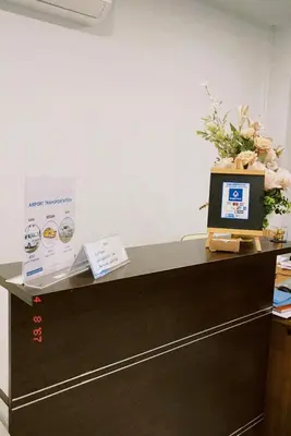 a desk with a laptop computer on top of it at Sasimanta in Kamala Beach