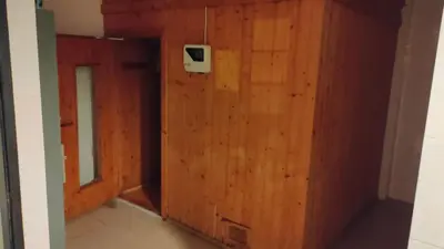 a room with a wooden wall with a door at Phuket Villa Patong Beach by Naphat in Patong Beach