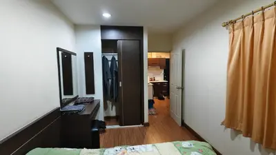a bedroom with a bed and a desk with a mirror at Phuket Villa Patong Beach by Naphat in Patong Beach