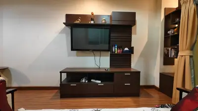 a entertainment center with a flat screen tv in a living room at Phuket Villa Patong Beach by Naphat in Patong Beach