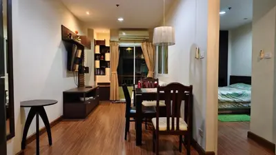 a room with a table and chairs and a bedroom at Phuket Villa Patong Beach by Naphat in Patong Beach