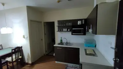 a small kitchen with a sink and a microwave at Phuket Villa Patong Beach by Naphat in Patong Beach