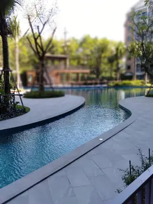 a swimming pool in the middle of a park at 2 Bedrooms Suite Pool Access@The Title Residencies Naiyang in Nai Yang Beach