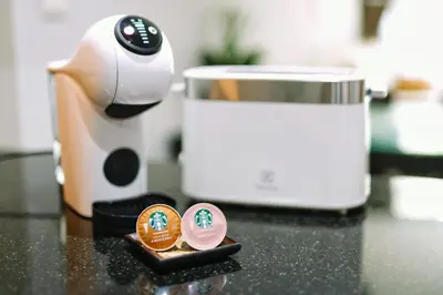 a counter top with a coffee pot and two small pins at Villa Casablanca in Ban Saiyuan (1)