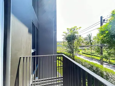 a balcony of a building with a view of a street at Sky park 2 BR lake view in Bang Tao Beach