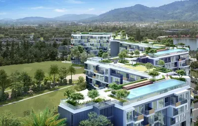an image of an apartment complex with trees at Sky park 2 BR lake view in Bang Tao Beach