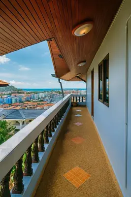 a balcony with a view of a city at Aksarai hotel in Patong Beach