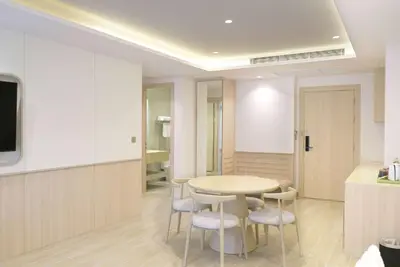 a dining room with a table and chairs at Wyndham Garden Naithon Phuket in Nai Thon Beach