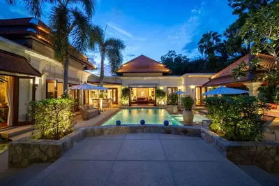 an image of a house with a swimming pool at Saitaan,4BR seaside garden pool villa, Laguna area in Bang Tao Beach