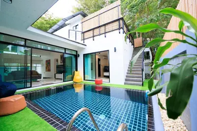 a swimming pool in the backyard of a house at Modern & fun pool villa at Kamala regent in Kamala Beach