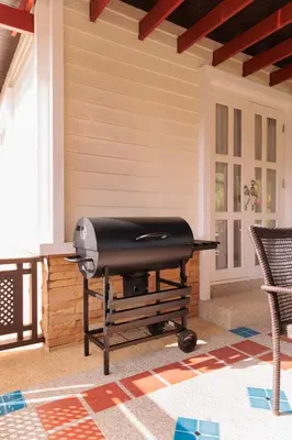 a bbq grill sitting on a patio at Villa with pool, garden and terrace - Kamala #123 in Phuket Town