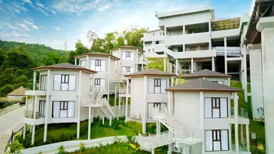 a row of white apartment buildings at Beyond Skywalk Nangshi in Ban Met Nang Chi