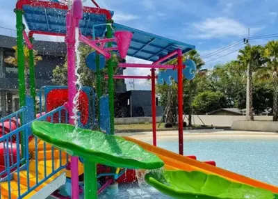 a playground with a water slide in a pool at Water park Rawai Beach 200m Nai Han king bedroom in Rawai Beach