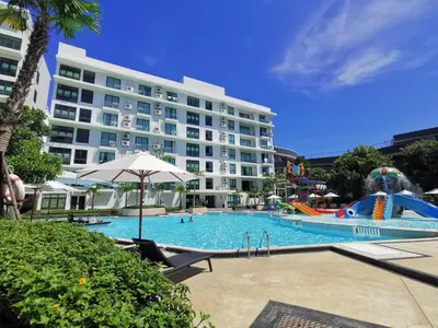 a large hotel with a large swimming pool with a water park at Water park Rawai Beach 200m Nai Han king bedroom in Rawai Beach
