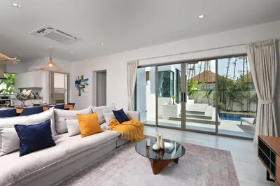 a living room with a couch and a table at 4bdr Pool Villa Suksan Rawai by CapitalPro SUK-20-154 in Phuket Town