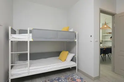 a bedroom with bunk beds with a yellow pillow at 4bdr Pool Villa Suksan Rawai by CapitalPro SUK-20-154 in Phuket Town
