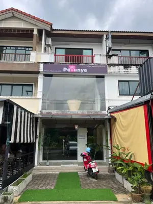 a scooter parked in front of a building at Petunya Room 2 in Ban Huai Luk (1)