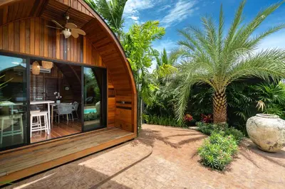 a house with a large glass door and a patio at Tropical Chalet 2BR Villa Pasak Paradise 1 with Private Pool, Laguna 10 min drive in Bang Tao Beach