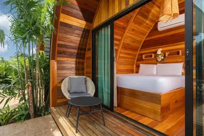 a room with a bed and a chair on a balcony at Tropical Chalet 2BR Villa Pasak Paradise 1 with Private Pool, Laguna 10 min drive in Bang Tao Beach